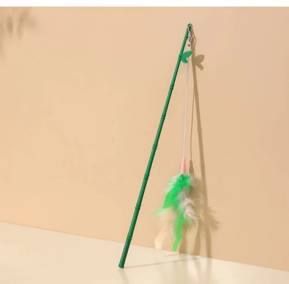 Green cat feather wand toy with bells and feathers on a durable wand with comfortable grip handle