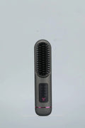 White, blue, and grey portable charging negative ion straight hair comb on a plain background.