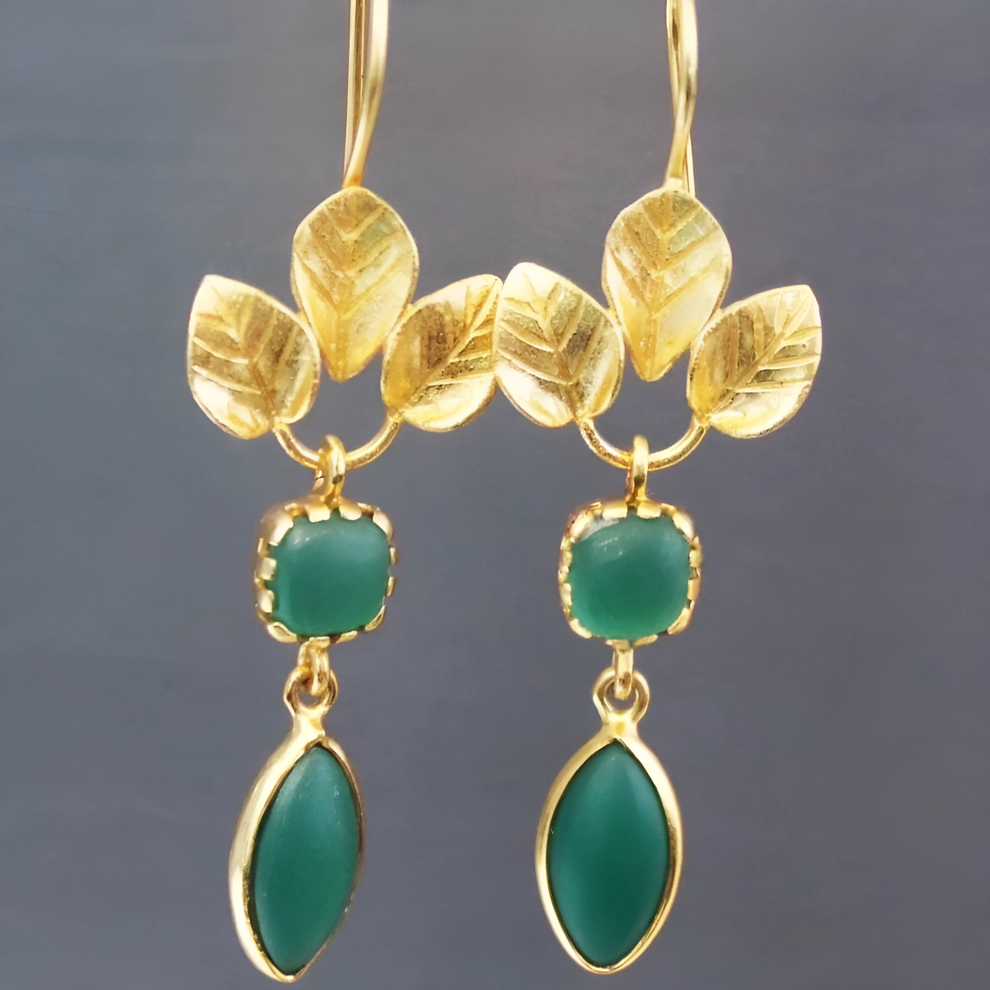 Gold retro drop earrings with French leaf and tassel charms and a central water drop zircon stone.