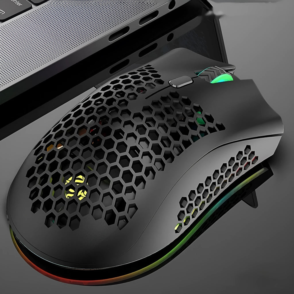 BM600 hollow out wireless gaming mouse with RGB lights in cyan colour on a desk