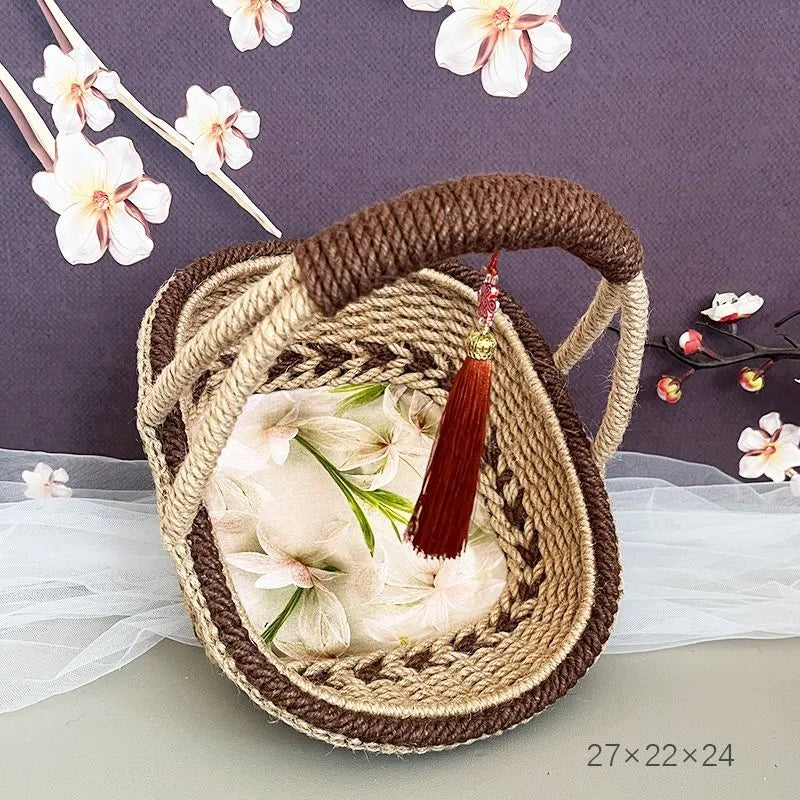 Hand-woven natural straw basket in a light brown colour, measuring 19cm by 12cm.
