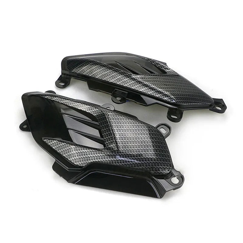 Yamaha NMAX side lamp replacement kit showing ABS plastic shell, PVC lamp shade, and stainless steel screws