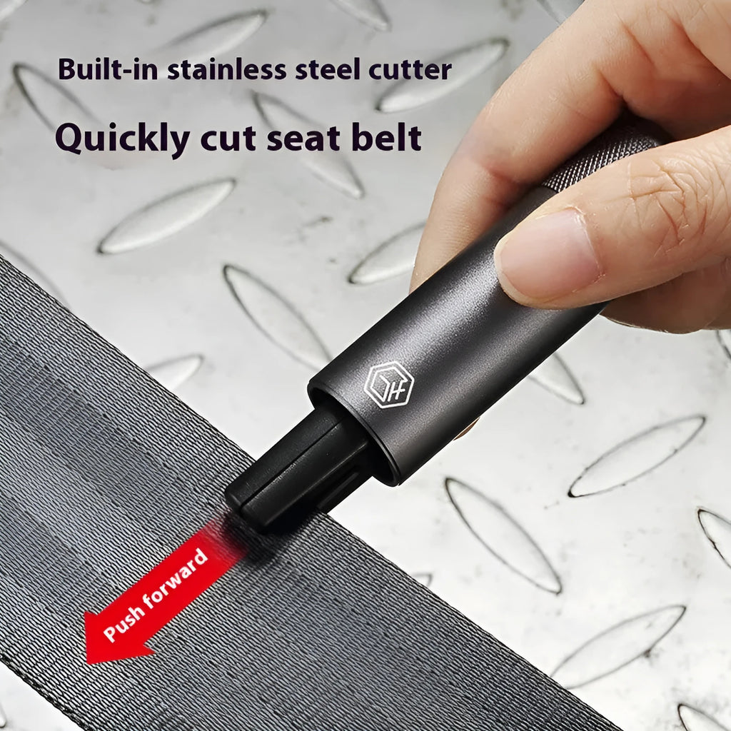 Gun grey aluminium alloy automobile safety hammer with seatbelt cutter, shown with test glass and 3M rubber base.