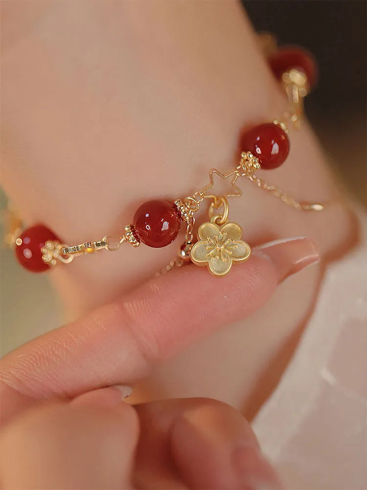 Women's double layer red agate bracelet with peach blossom flower elements and ethnic design