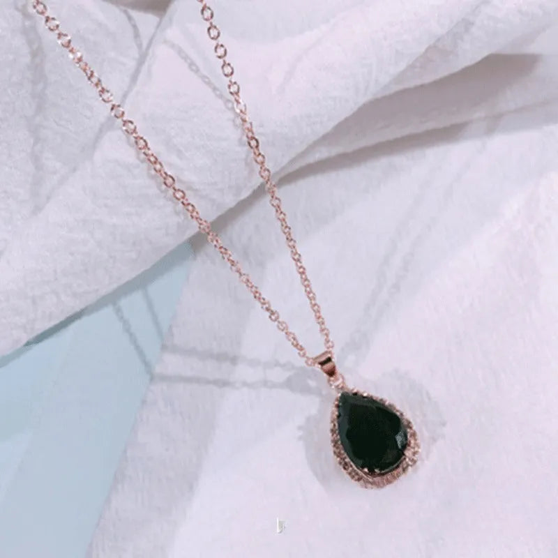 Pink rose gold drop shape rhinestone necklace with geometric design on alloy chain