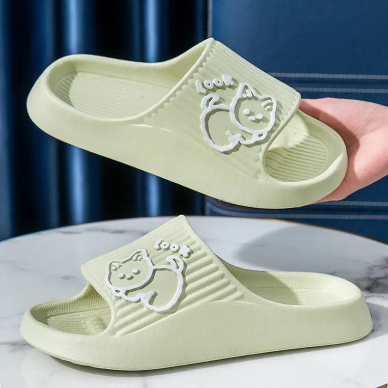 Green EVA foam cat slippers with thick platform sole and anti-slip pattern.