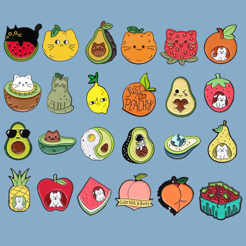Colourful cartoon fruit design zinc alloy brooch pin on a fabric background.