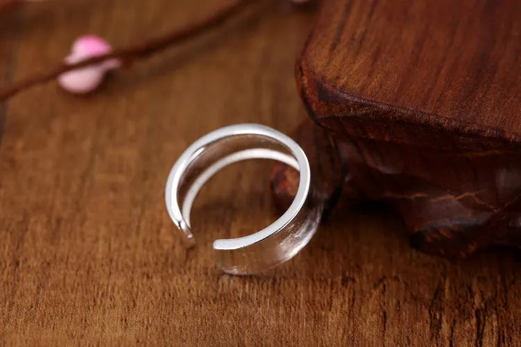 Adjustable opening geometric frosted sterling silver ring with open design
