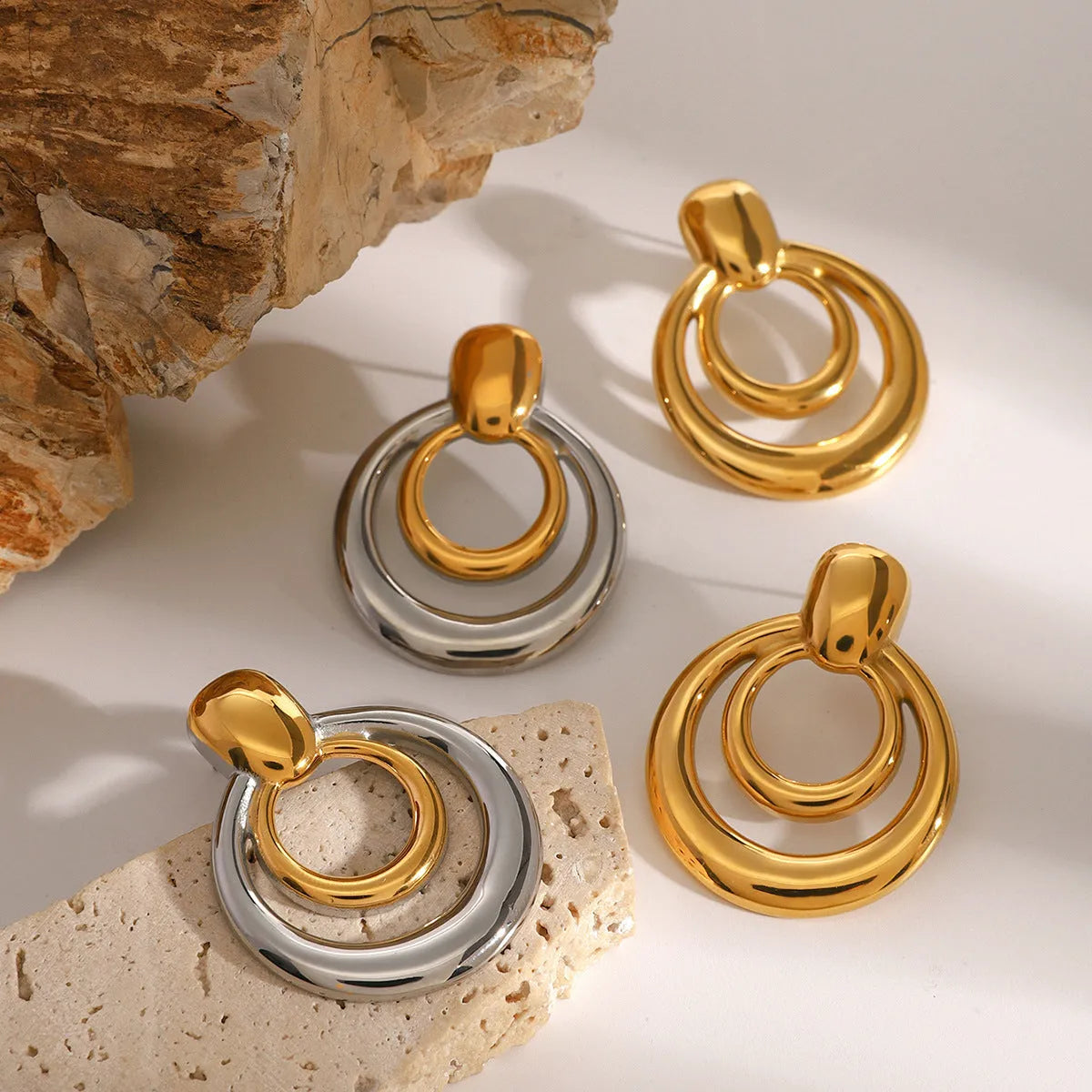 Round golden double-layer hollow stud earrings with geometric design and electroplated finish