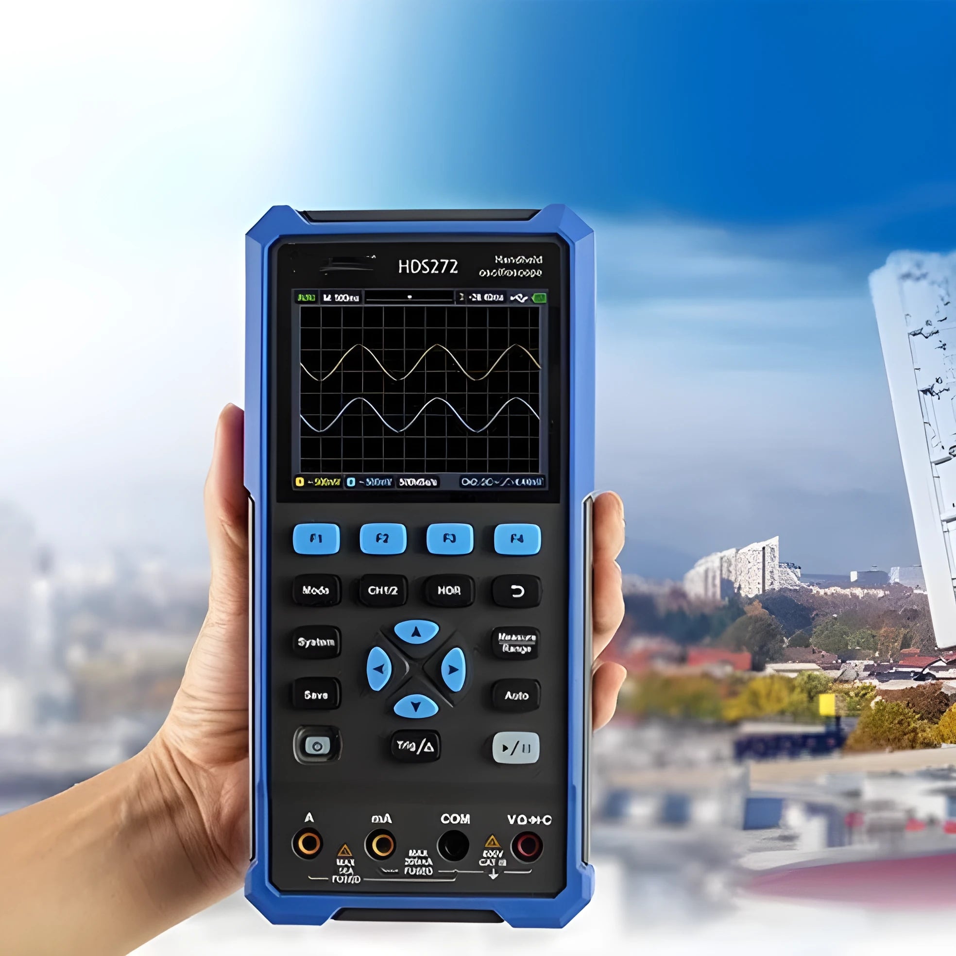Handheld digital oscilloscope with probe on workbench for automotive electrical testing.
