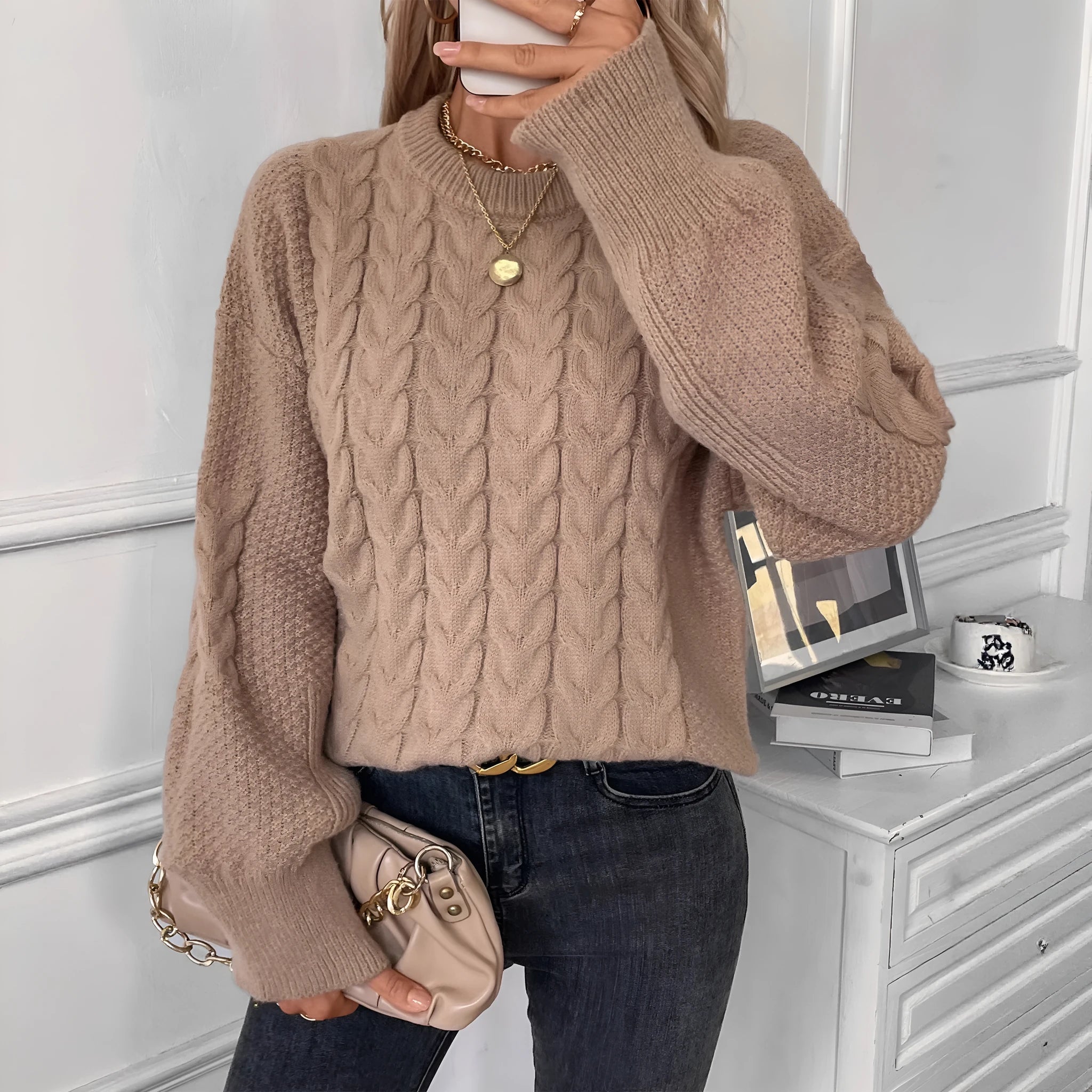 Women's beige loose pullover sweater with round neck and regular sleeves on hanger