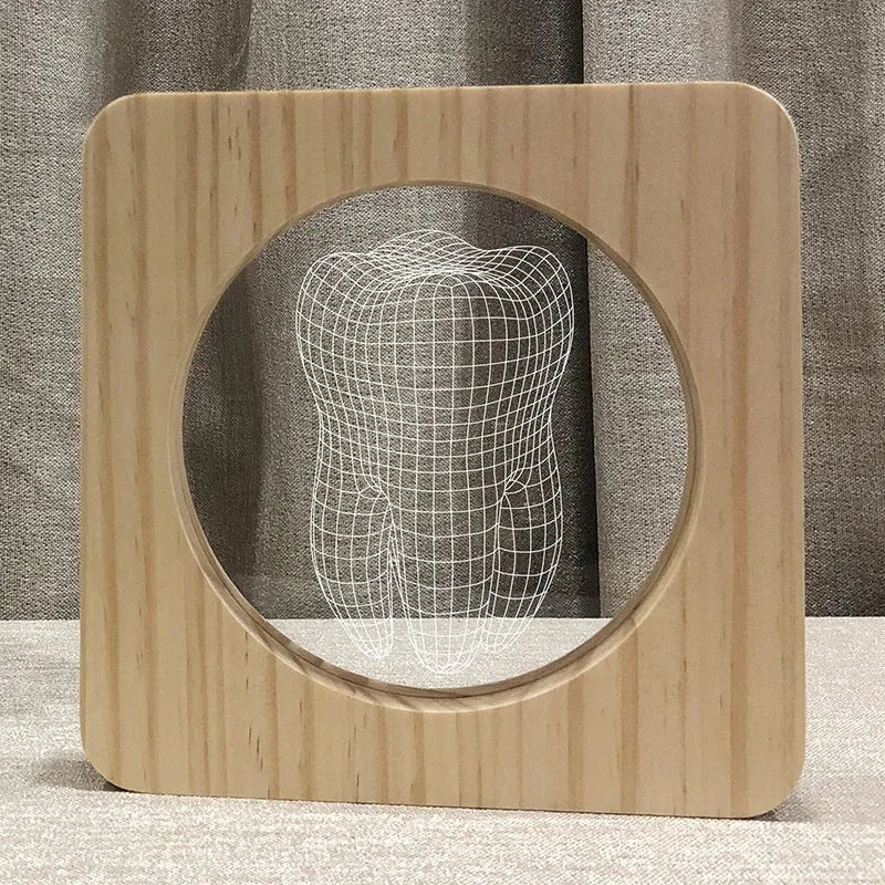 Tooth shaped wooden colour acrylic night lamp with USB cable on white background