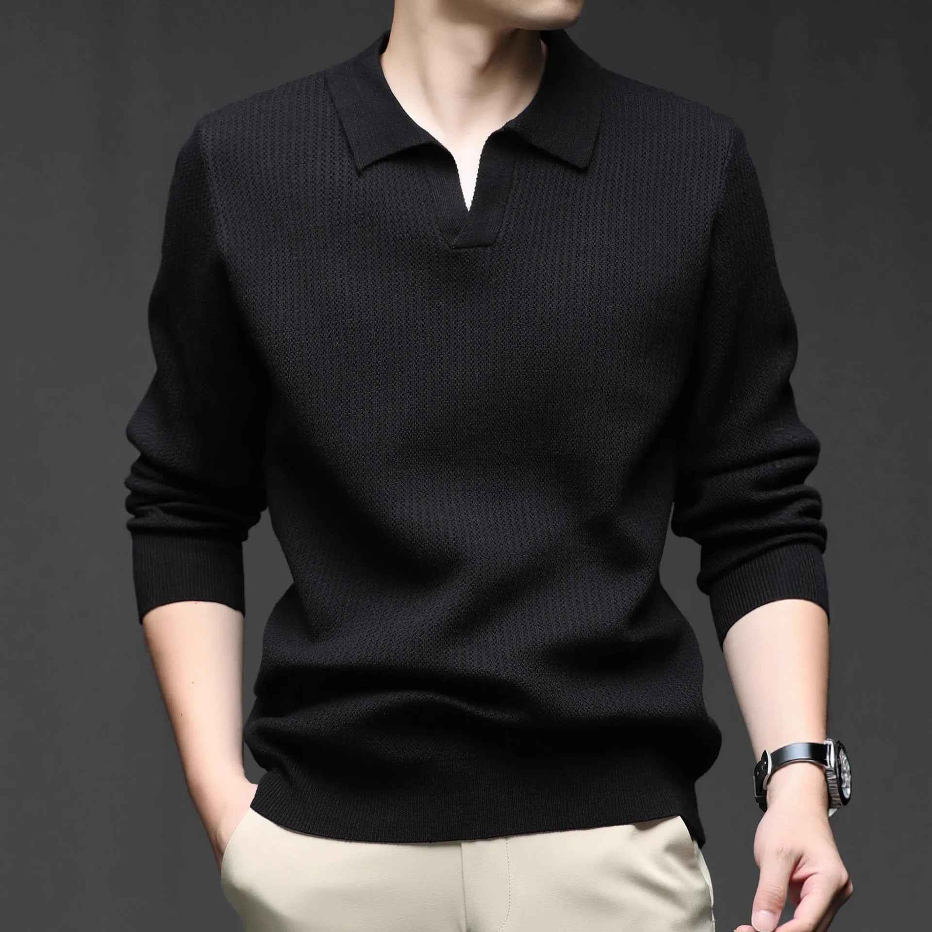 Man wearing a loose green pullover sweater, a casual autumn bottoming layer.