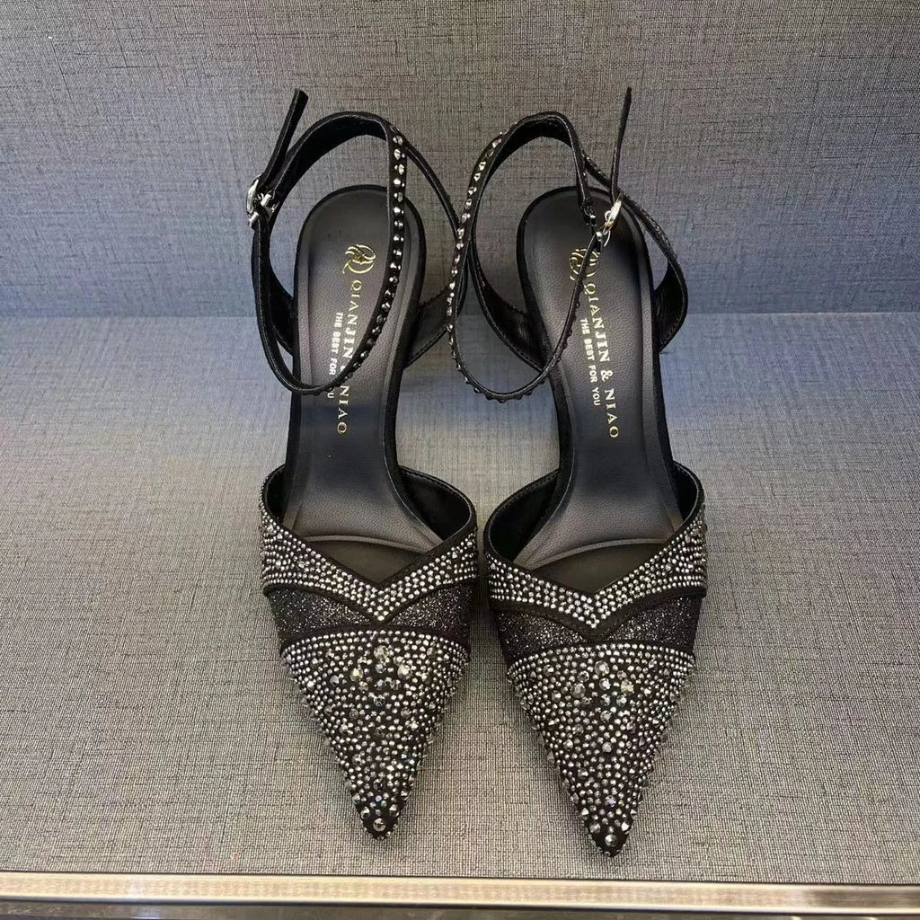 Women's black and silver hollow high heels with red sole and stiletto heel design