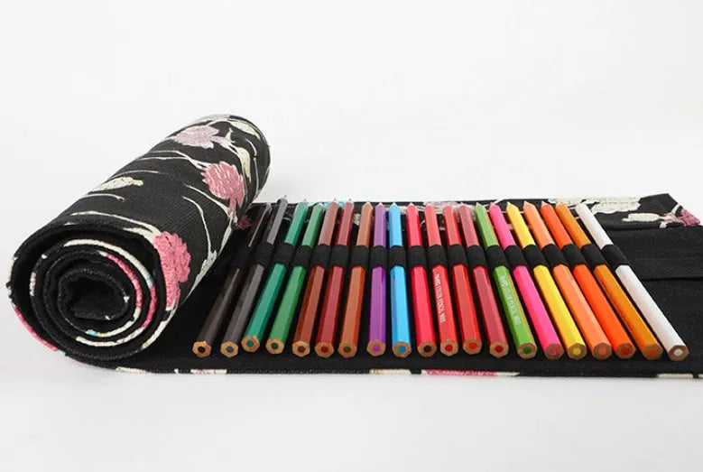 Square canvas rolling pencil case with ballet girl print, unfurled to show multiple pencil slots.