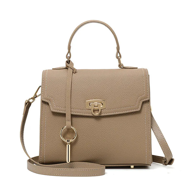 Elephant grey genuine leather crossbody bag with vintage lock and litchi pattern showing square vertical design