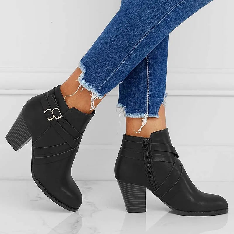 Women's plus size black short ankle boots with 7cm chunky heel and side zipper.