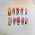 Hand carved false nails featuring a textured zebra pattern lily design in sizes XS, S, M, L.