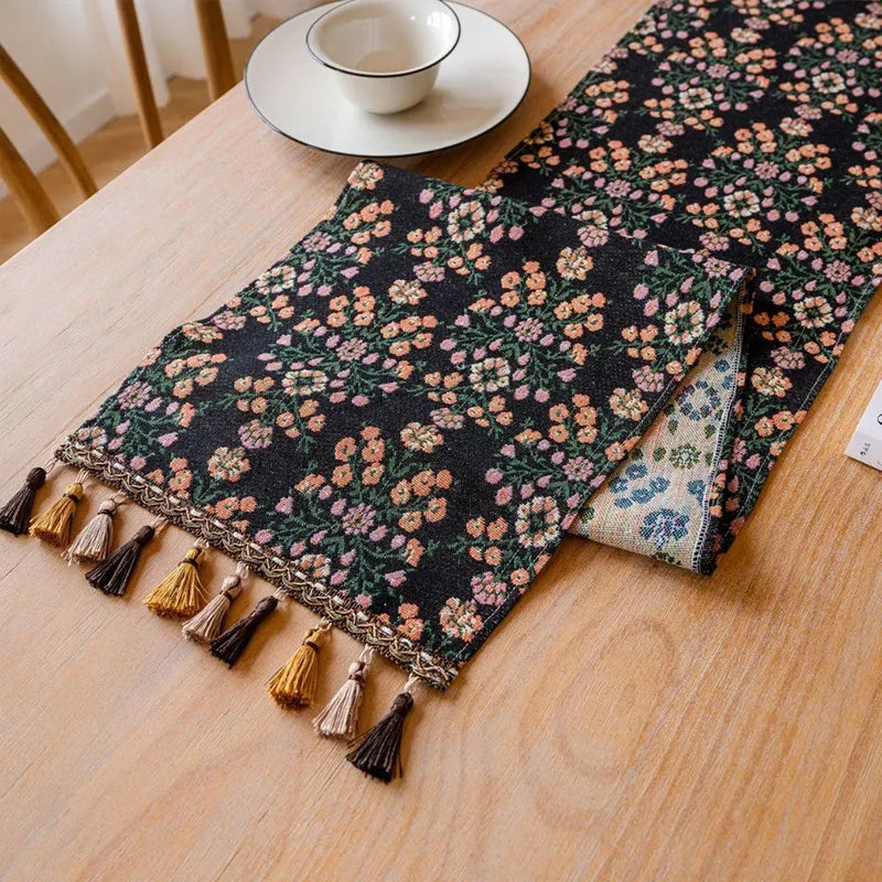 Rhyme Nordic Jacquard table runner with bouquet stripe pattern and tassel trim on dining table