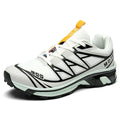Low-top hiking shoes in artificial leather with mesh lining and a flat rubber sole.