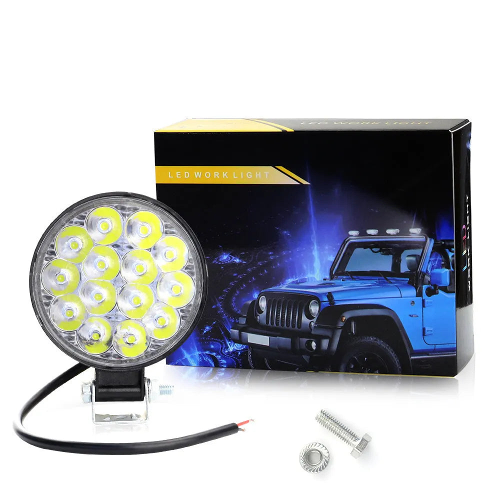 White aluminium LED work light unit with IP67 waterproof rating, suitable for car and off-road vehicle mounting.