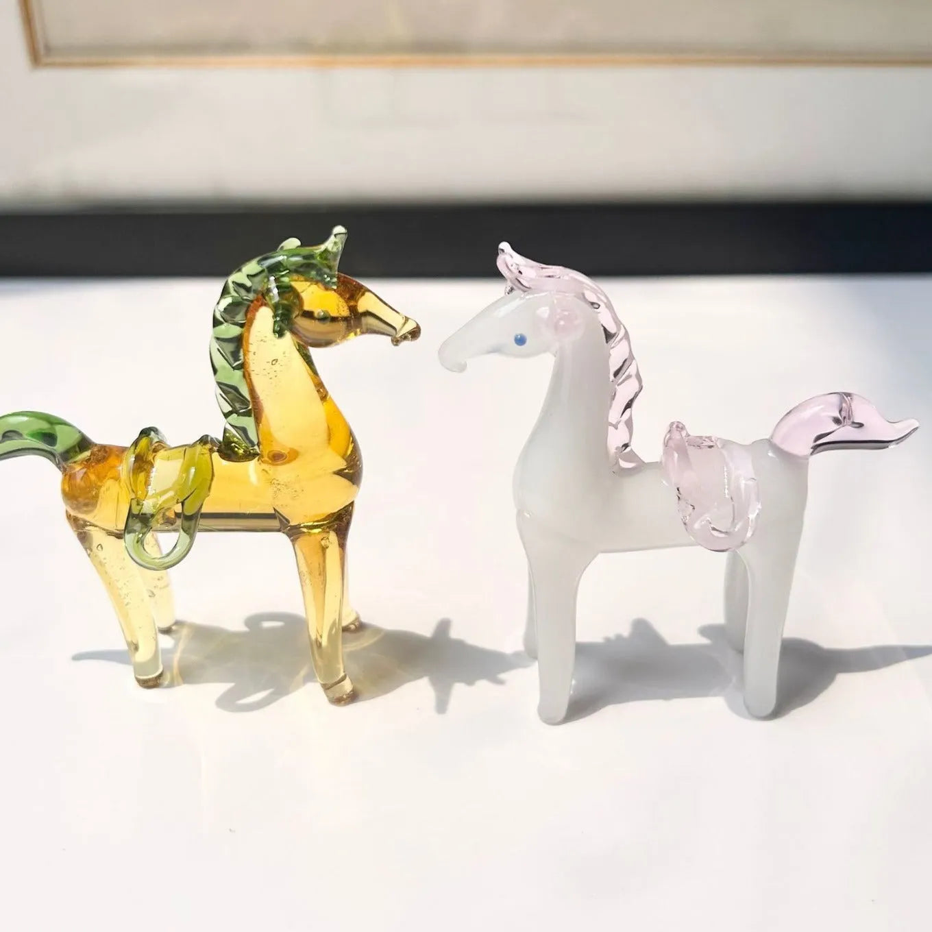 Glazed ceramic horse figurine decoration in modern simplicity style on a desk.