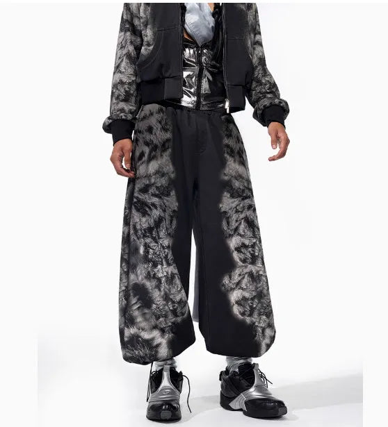 Three-piece streetwear co-ord set showing hoodie, loose trousers and seven-inch shorts with printed collage design