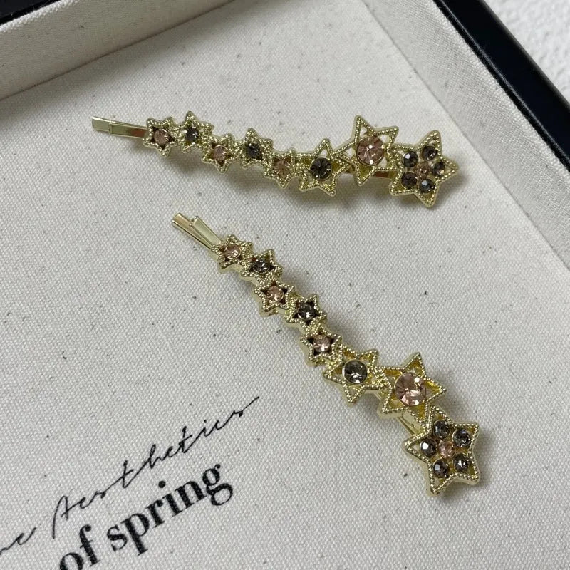 Gold electroplated alloy rhinestone barrettes with side clip bangs design and five-pointed star charms