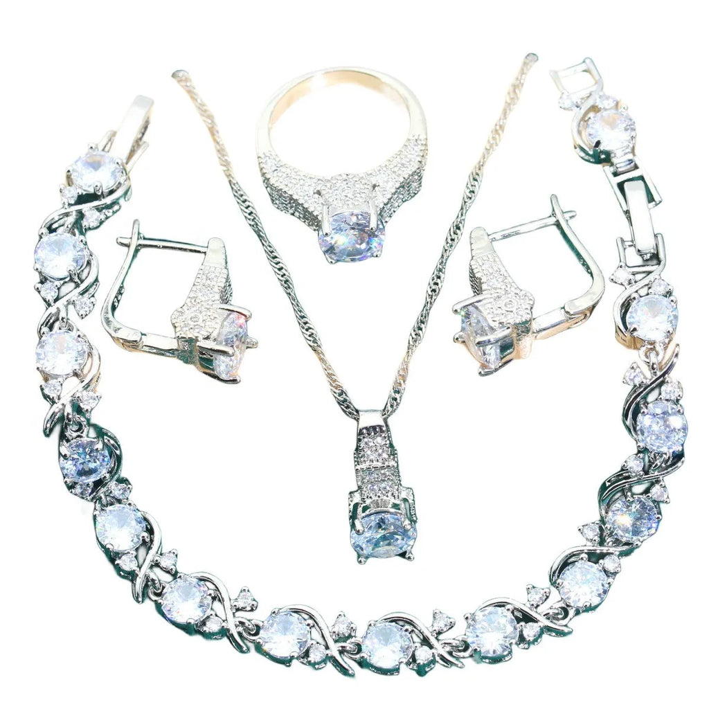 Bridal zircon jewellery four-piece set showing necklace, bracelet, earrings, and ring with water wave chain styling