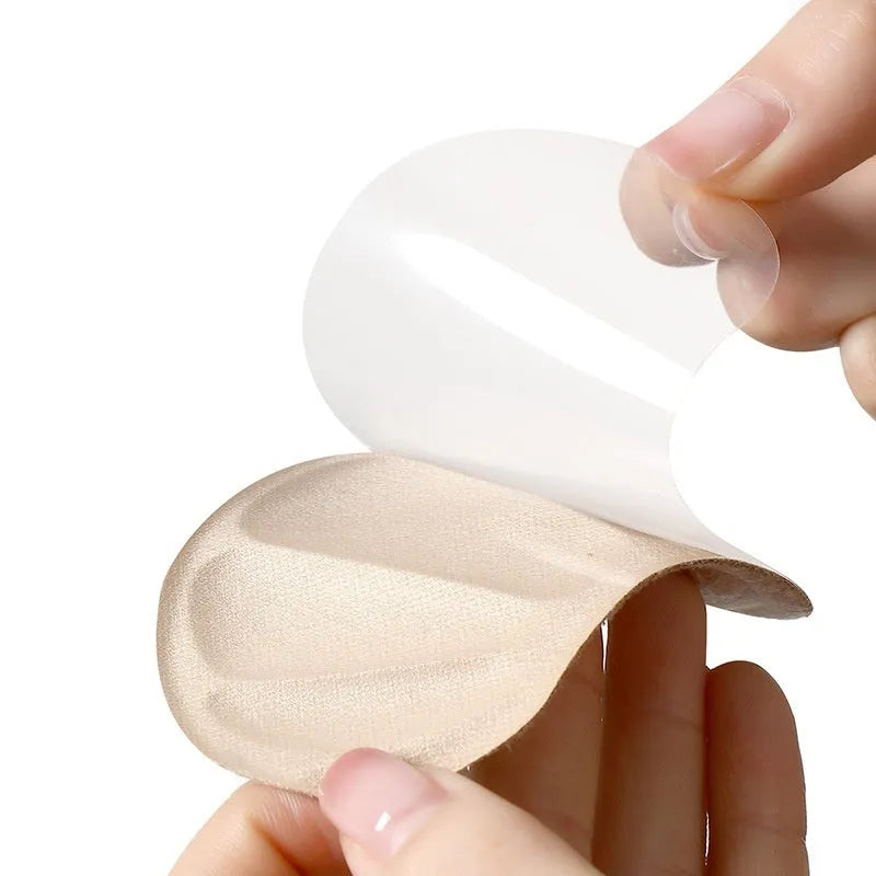Three pairs of camel colour adhesive heel cushion pads with suede surface measuring 9.3cm by 6cm