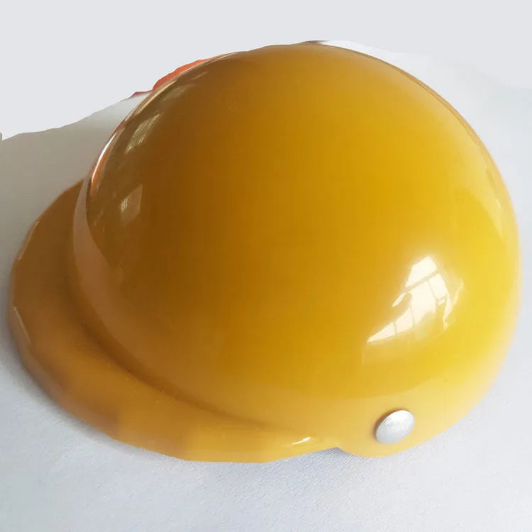 Plastic dog motorcycle cap helmet in various colours and sizes on a table