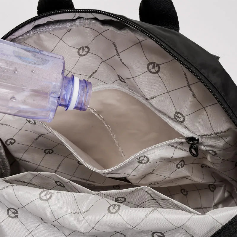 Large nylon backpack in black colour showing sandwich pocket design and dimensions