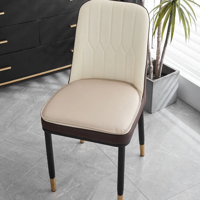 Leather horseshoe-shaped seat cushion with non-slip base in beige colour