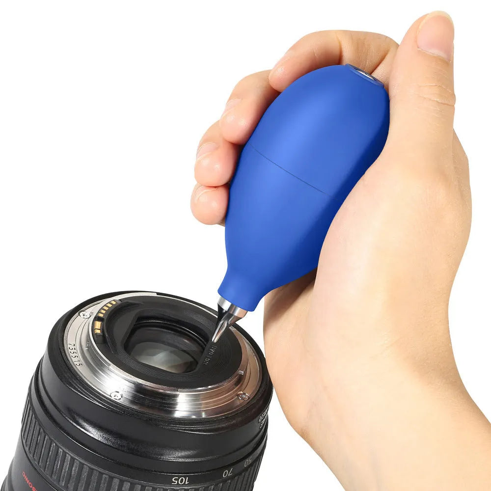 Blue or black rubber air blower dust removal tool for cleaning cameras and phones.