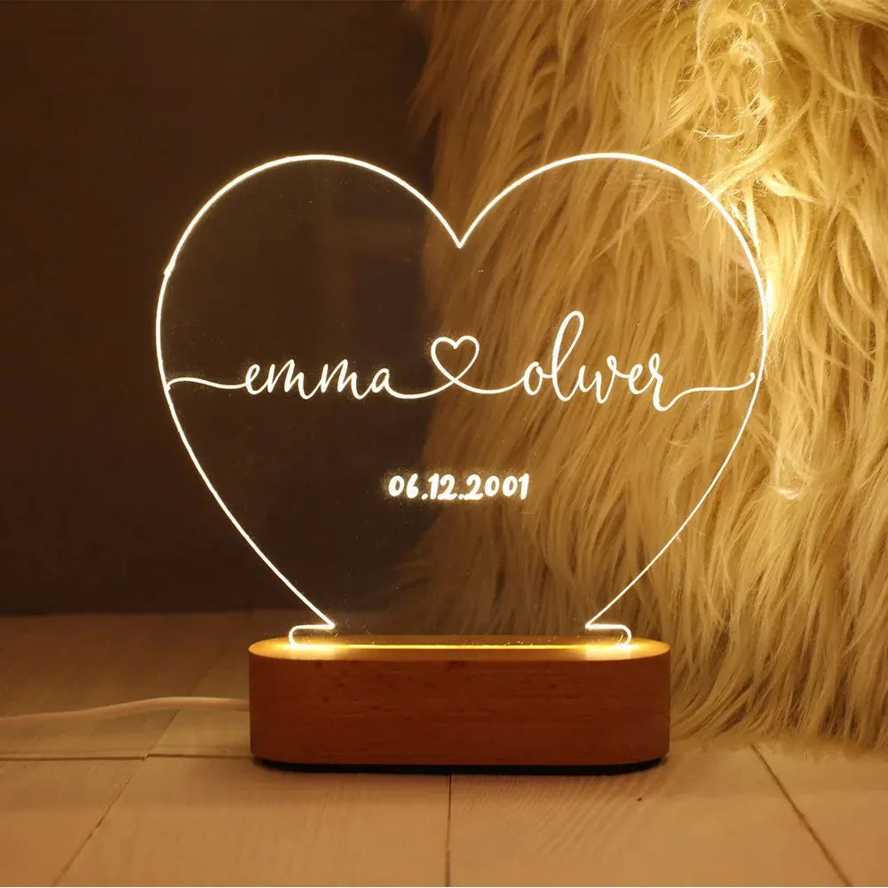 Custom acrylic LED night light displaying personal names and date, 20cm by 11.5cm, with USB cable.