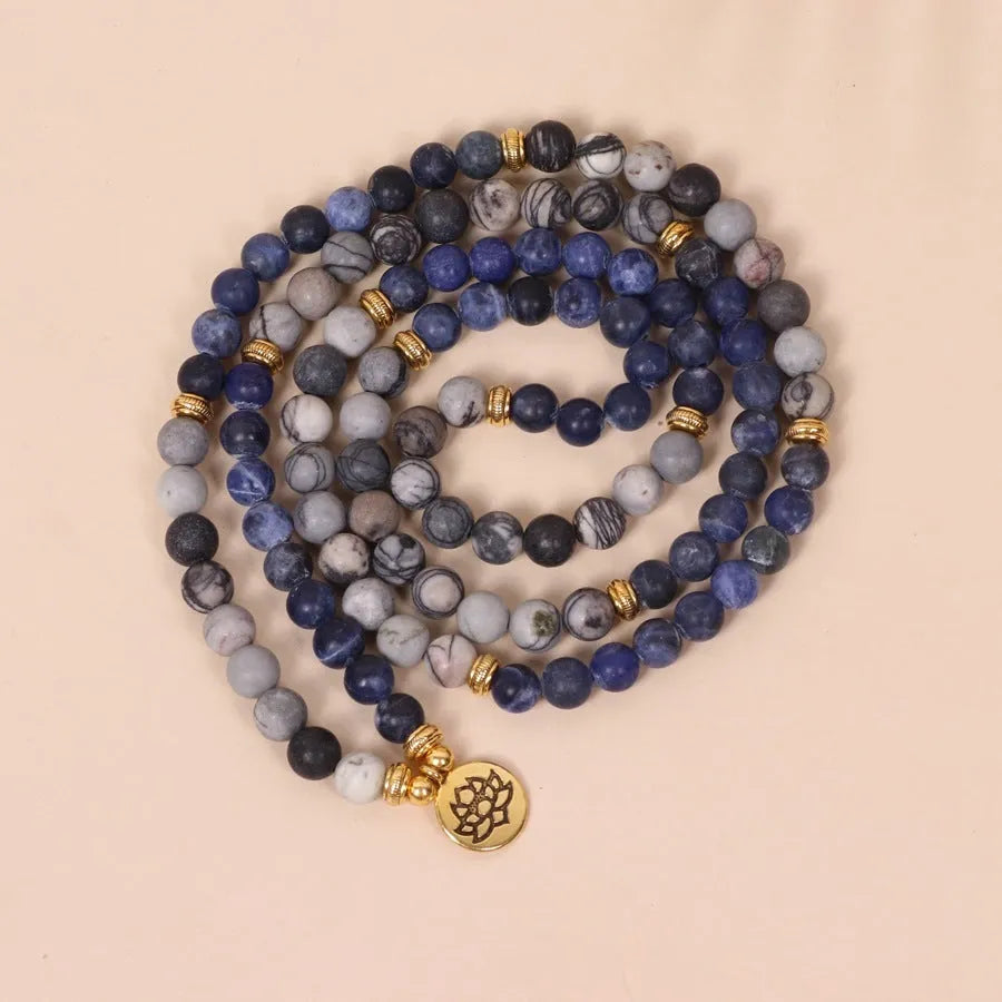 Blue multi-layer alloy bracelet with patterned network stone beads.