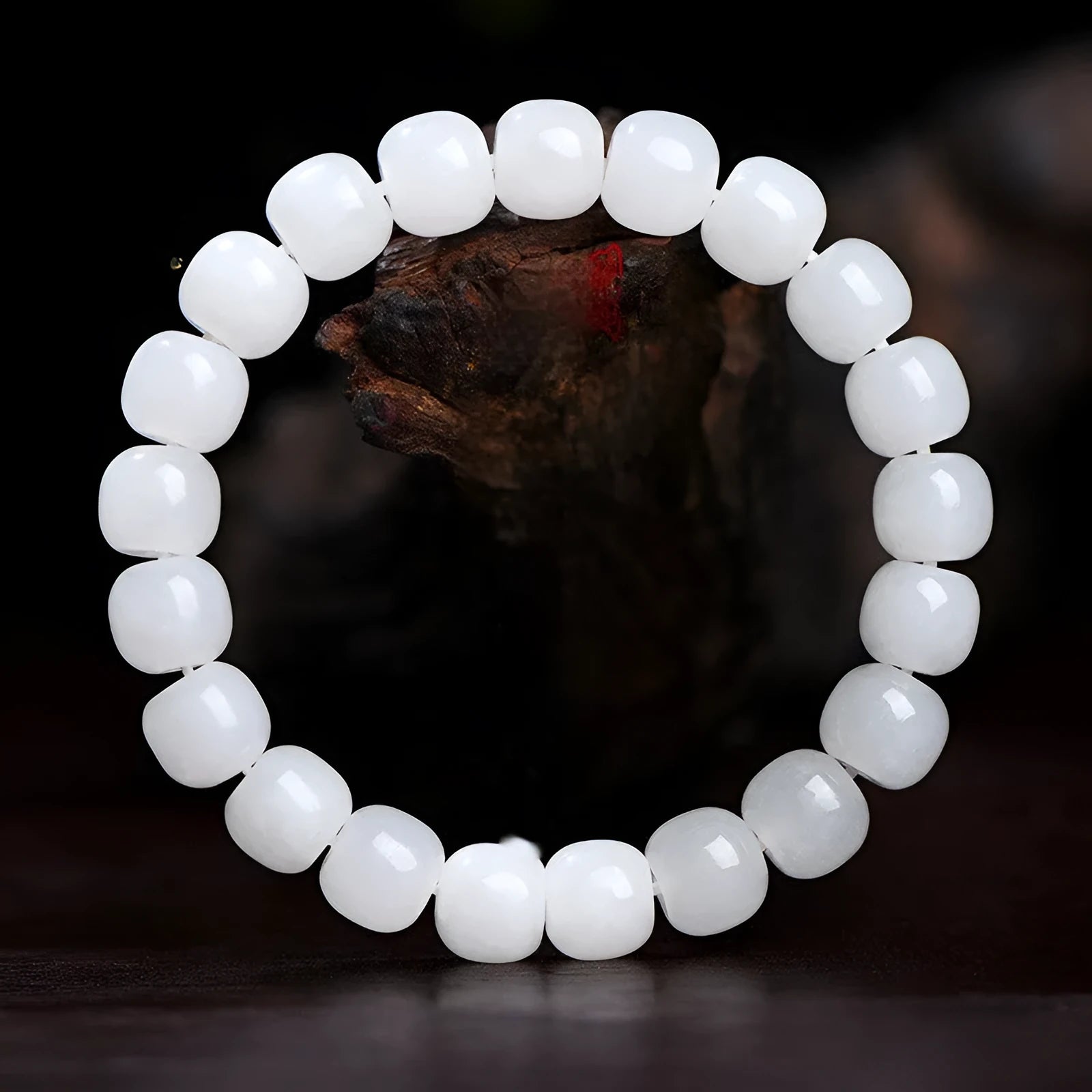 White Hetian jade barrel bead bracelet showing smooth polished beads on wrist