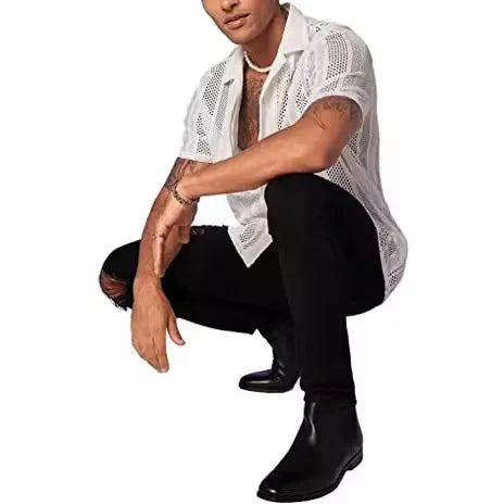 Man wearing a black knitted short-sleeved button shirt with a jacquard pattern, cardigan style.