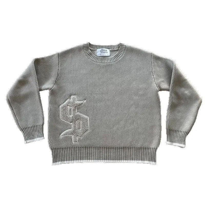 Grey loose-fitting jacquard knit coat on a hanger, showing long sleeves and textured knit pattern.