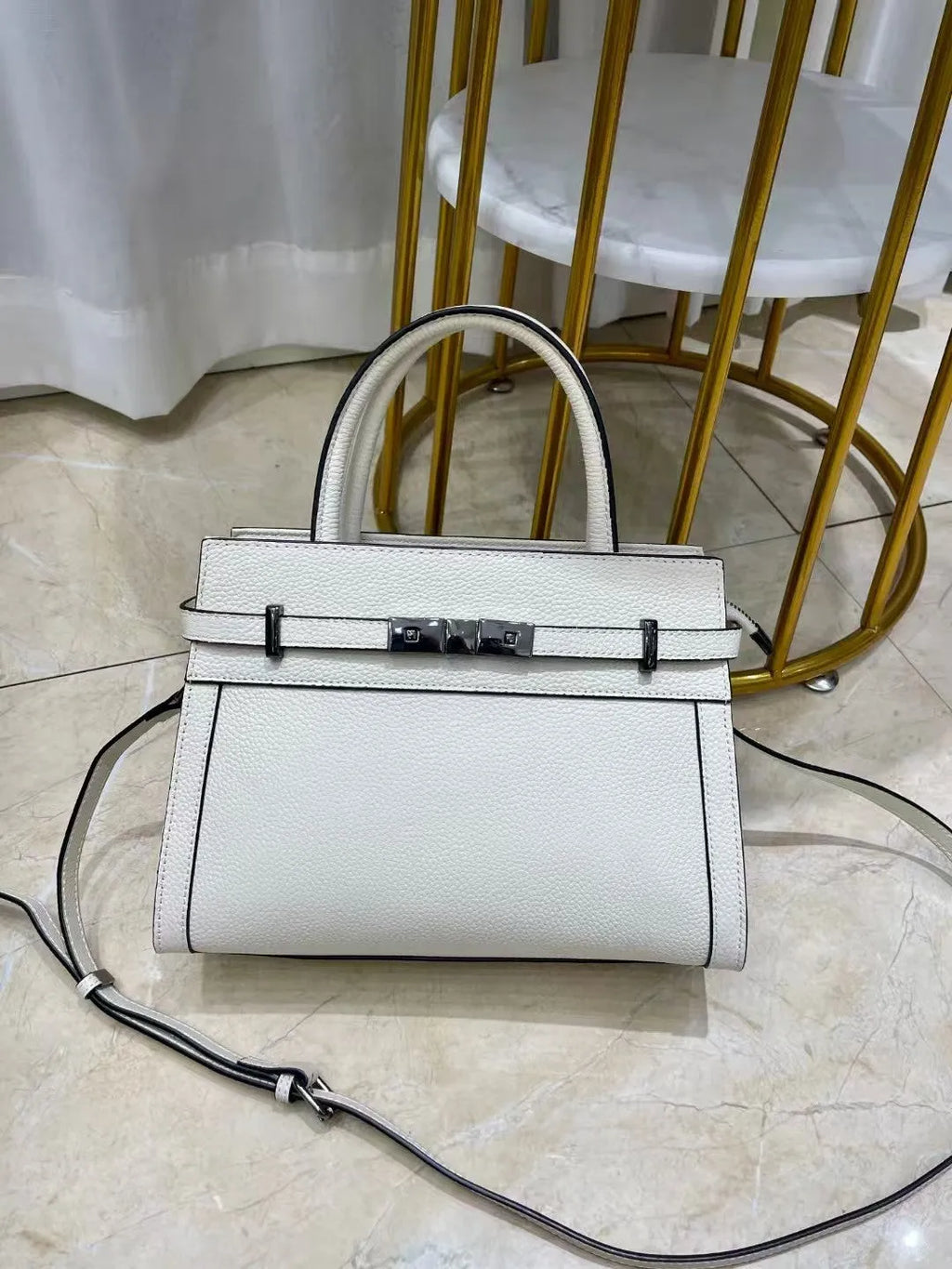 Small square genuine leather shoulder bag with zip compartments in almond green colour
