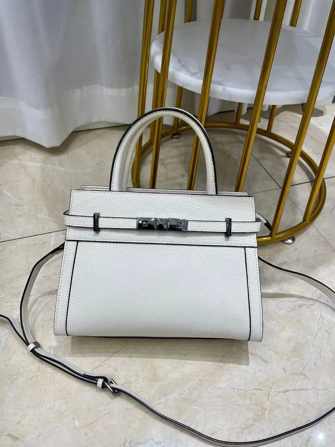 Small square genuine leather shoulder bag with zip compartments in almond green colour