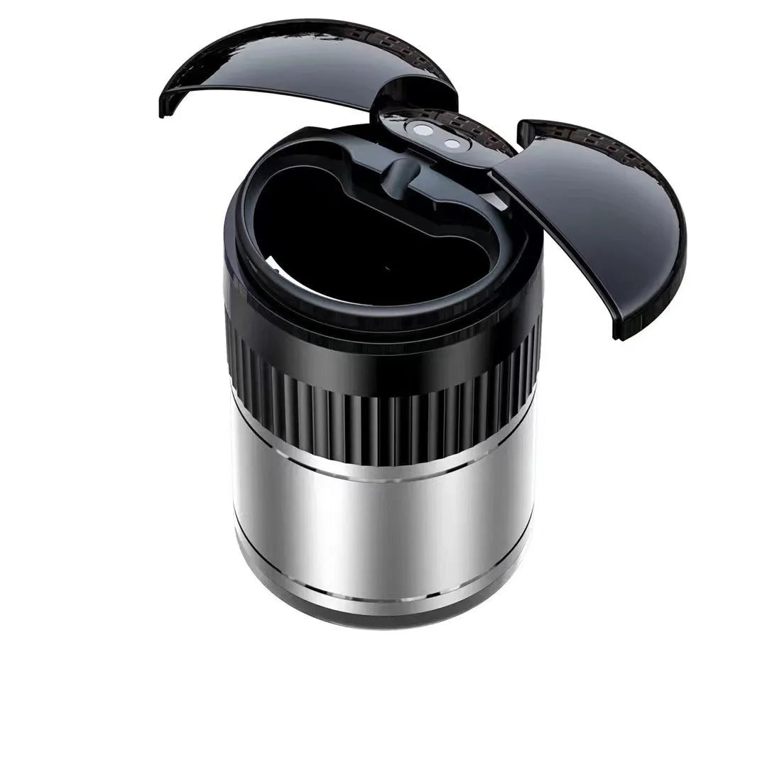 Black automatic sensing touch infrared metal car ashtray with lid on a car console.