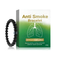 Men's black gallstone and glass smoke prevention bracelet on wrist.