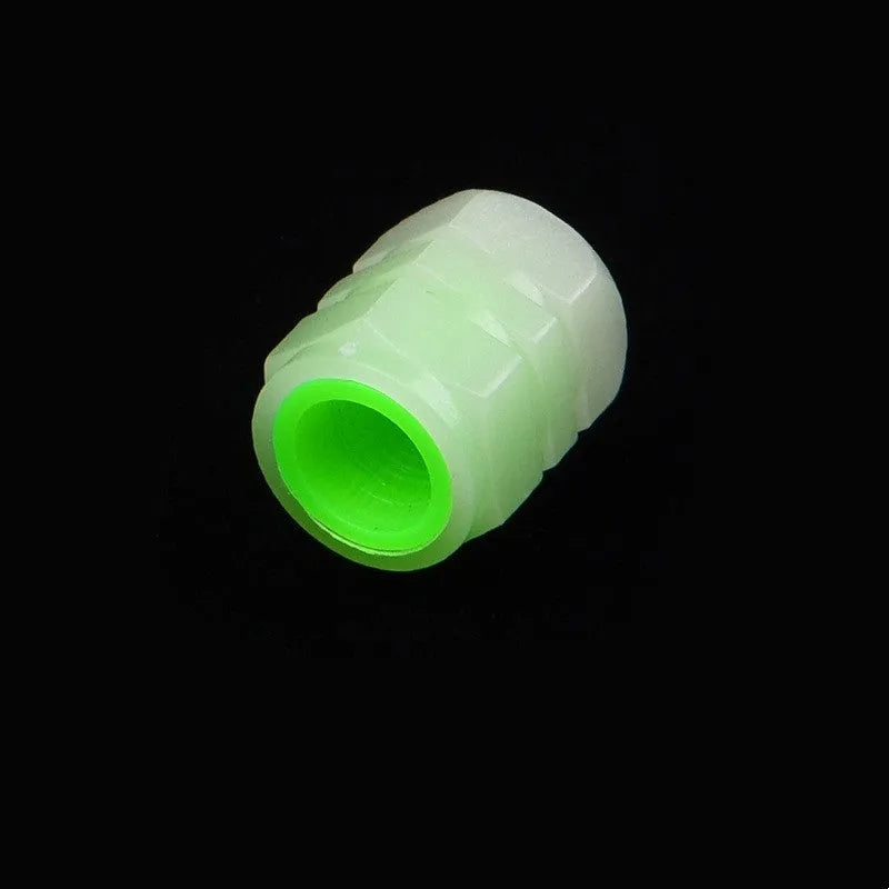 Glow-in-the-dark rubber car tyre valve caps in a set, showing size and luminous feature.