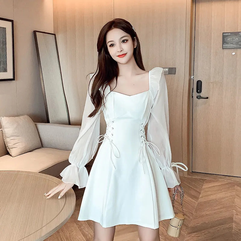 White chiffon patchwork waist-slimming maxi dress with long sleeves on mannequin