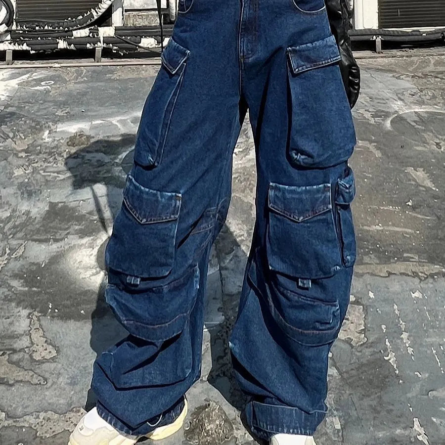 Dark blue wide-leg distressed jeans with high waist and multiple pockets on a mannequin
