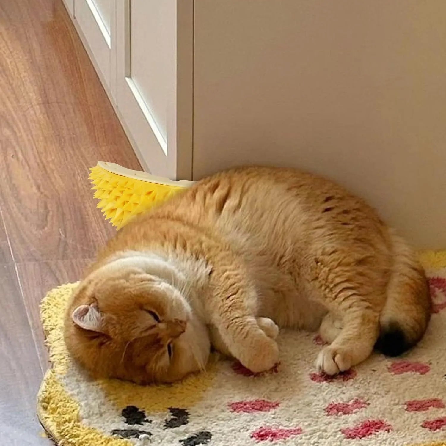 Yellow durian-shaped cat corner scratcher with massage comb mounted on wall corner