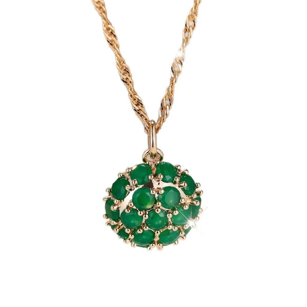 Champagne gold round emerald and diamond pendant necklace on a copper chain