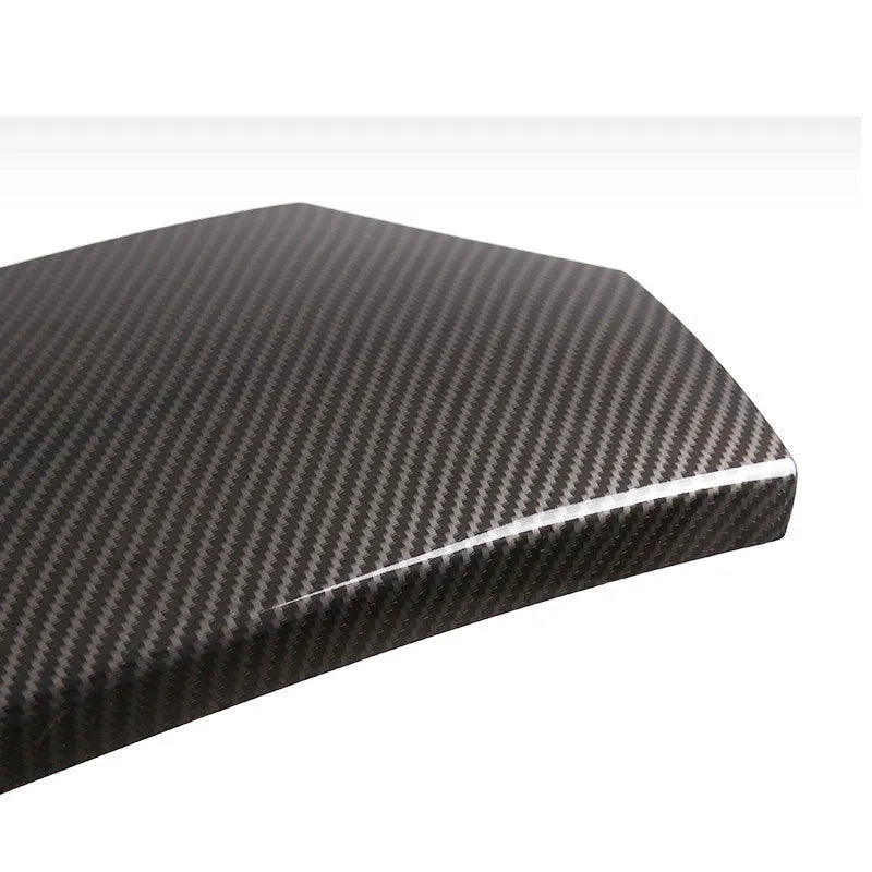 Set of three black ABS armrest box covers with a diagonal carbon fibre pattern and shiny finish.