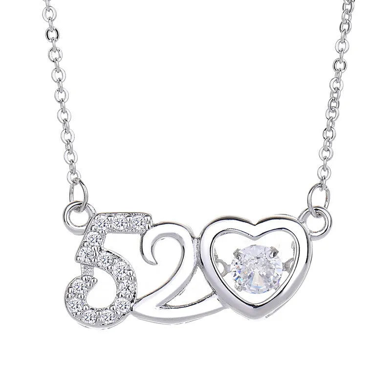 Silver heart-shaped pendant necklace with crown and bow charms for women